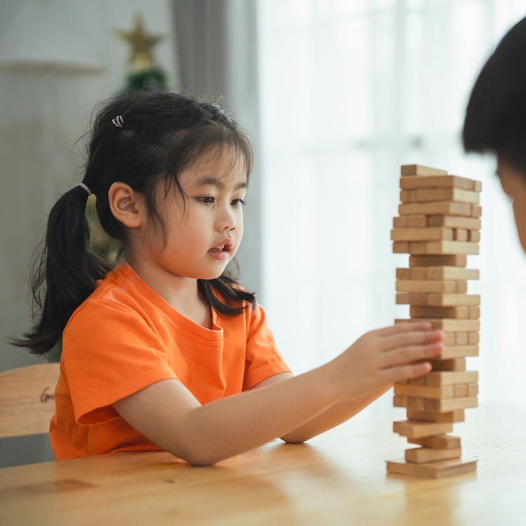 Girl playing jenga